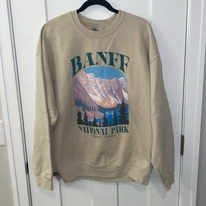 Banff Graphic Crewneck purchased from Etsy Shop Kozy Vibes. Size XL - Color Sand